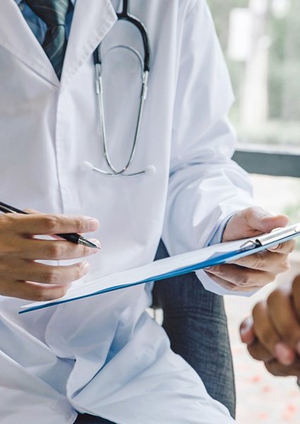 Patient and doctor discussing homeopathic treatment options during consultation