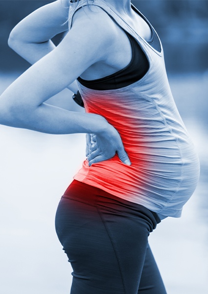 Woman experiencing pernatal back pain