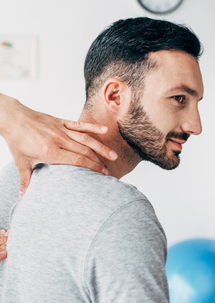 Doctor providing cranial osteopathy