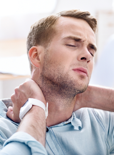 Man holding his neck before pain management treatment