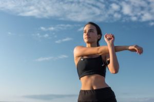 Woman exercising outside after successful prolotherapy treatment